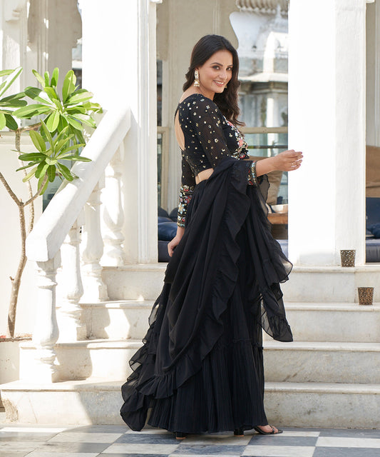 Black tiered lehenga choli with matching dupatta, featuring a stylish layered design and elegant detailing