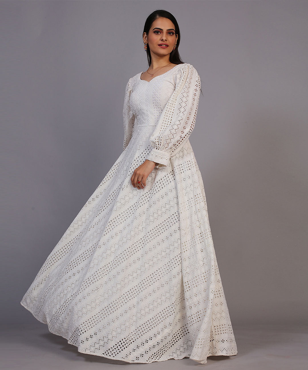 Classic off-white Lucknowi embroidered floor-length gown, showcasing timeless elegance and craftsmanship.