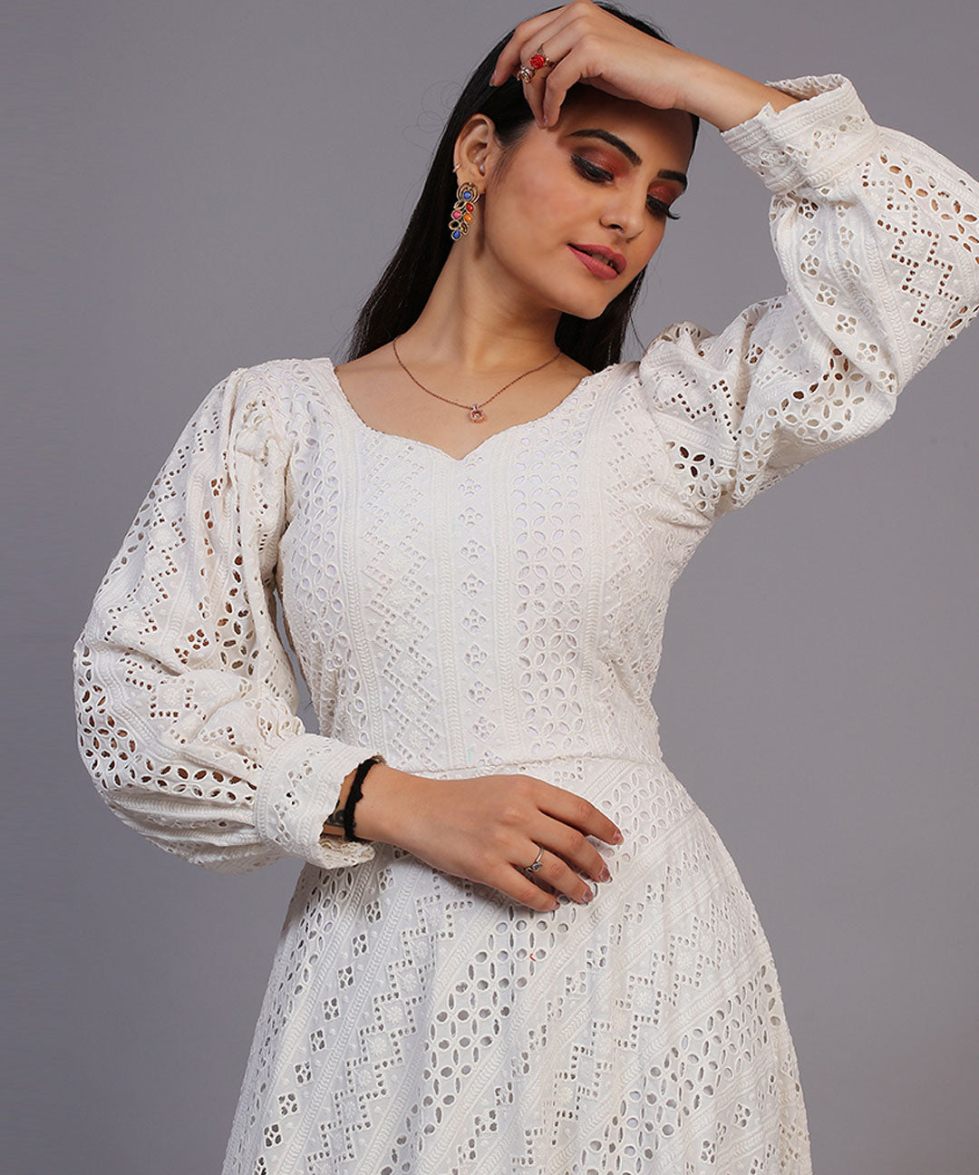 Classic off-white Lucknowi embroidered floor-length gown, showcasing timeless elegance and craftsmanship.