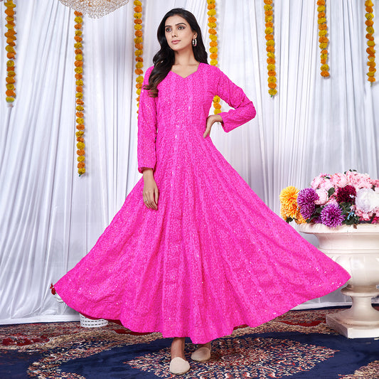 A dark pink georgette gown adorned with intricate Lucknowi embroidery.