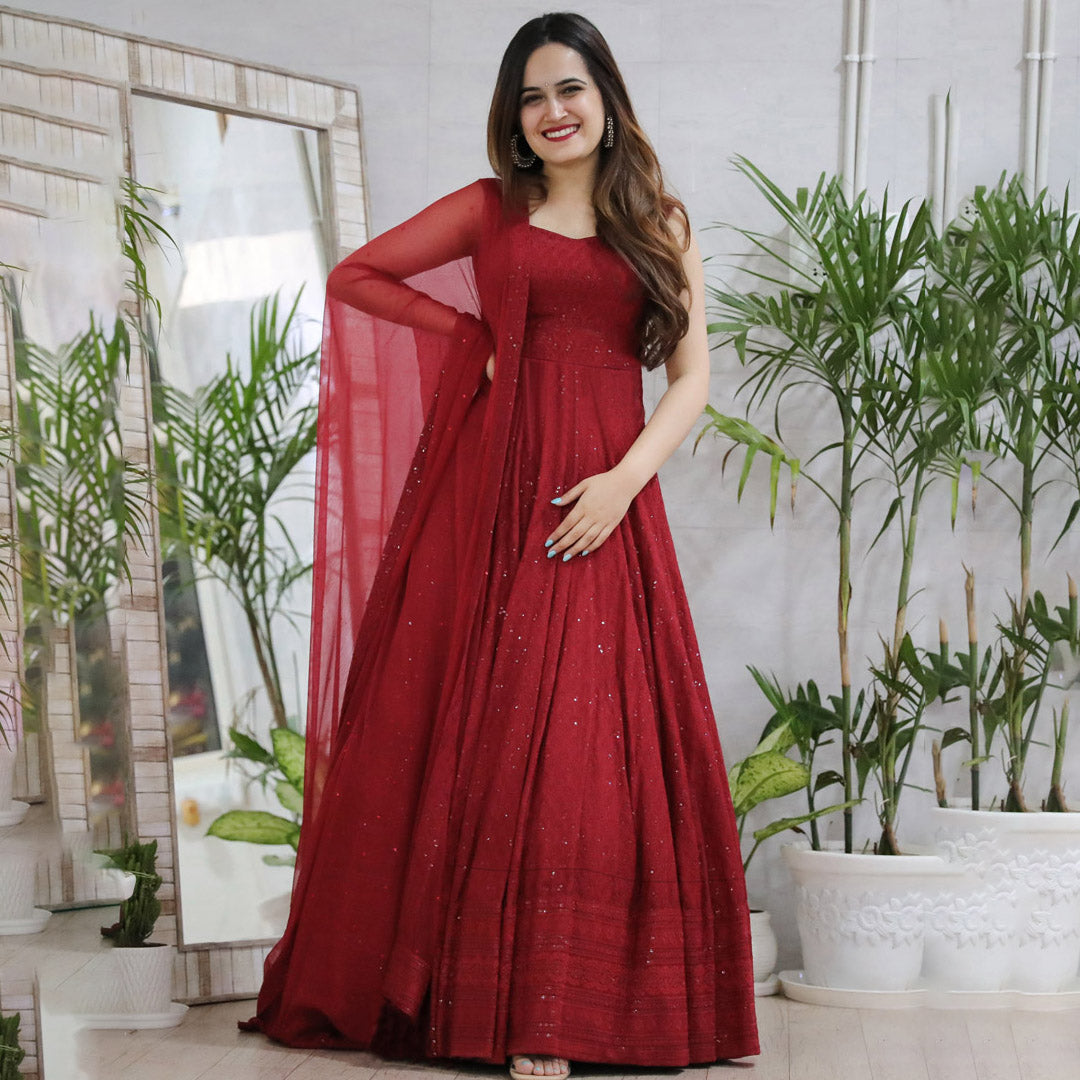 Elegant designer anarkali gown in rayon, featuring intricate Lucknowi chikankari embroidery.