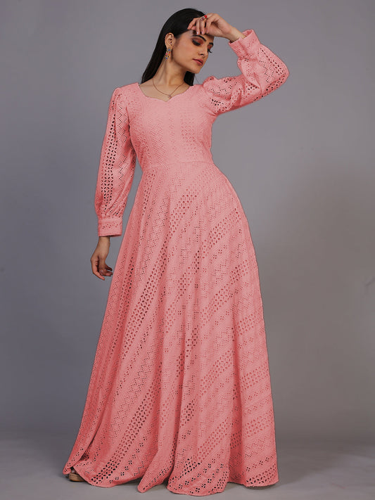 A delicate peach gown featuring beautiful Lucknowi embroidery, cascading down to an elegant floor-length design.