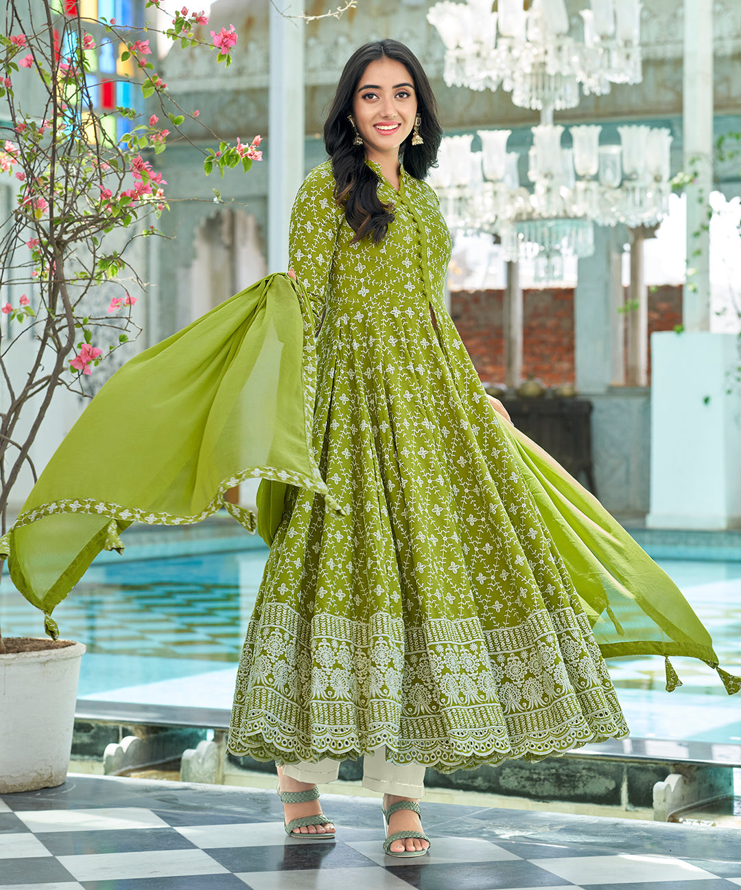 A graceful Tender Green Chikankari Suit Set, embellished with delicate chikankari embroidery for an elegant and refined appearance.