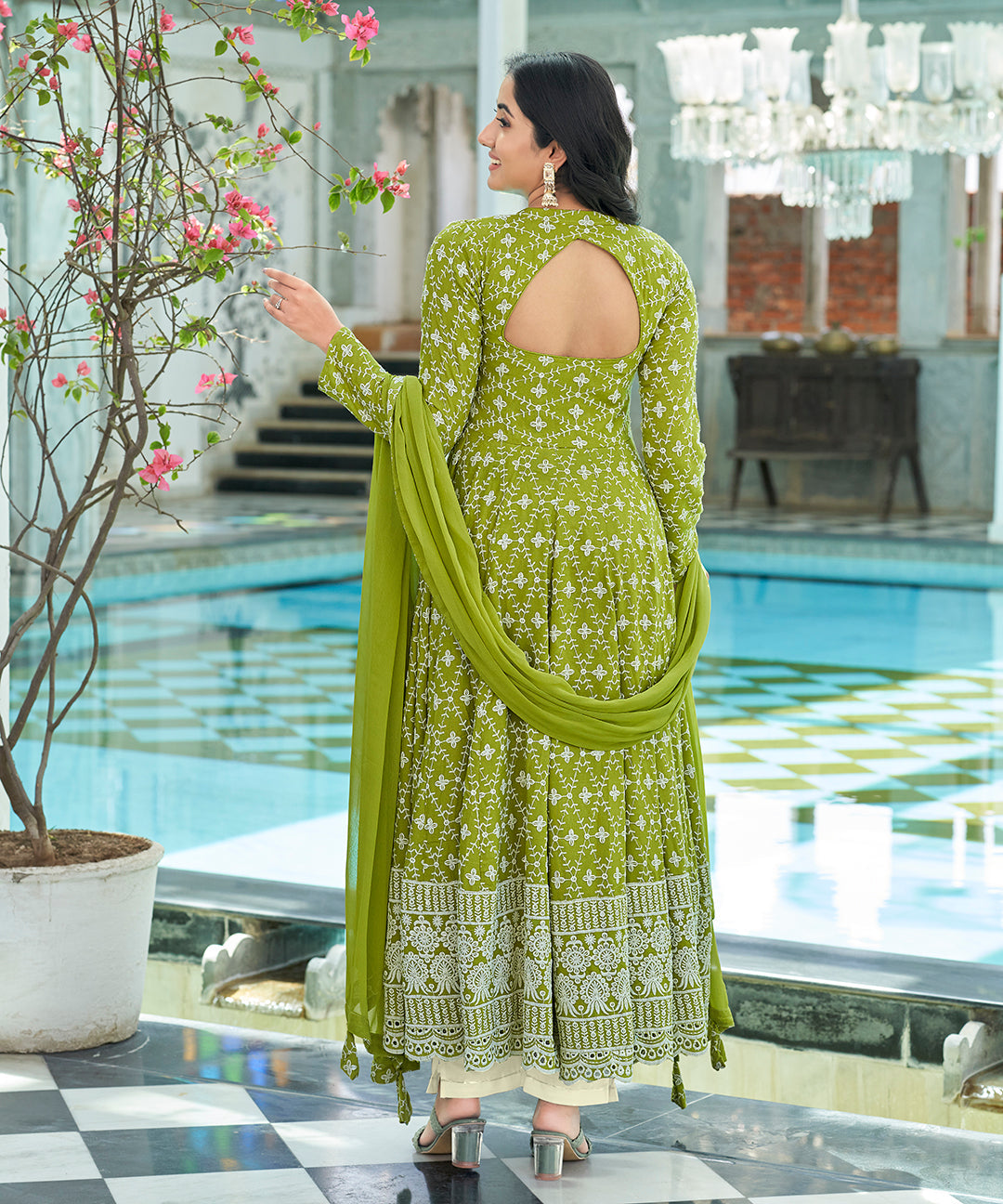 A graceful Tender Green Chikankari Suit Set, embellished with delicate chikankari embroidery for an elegant and refined appearance.