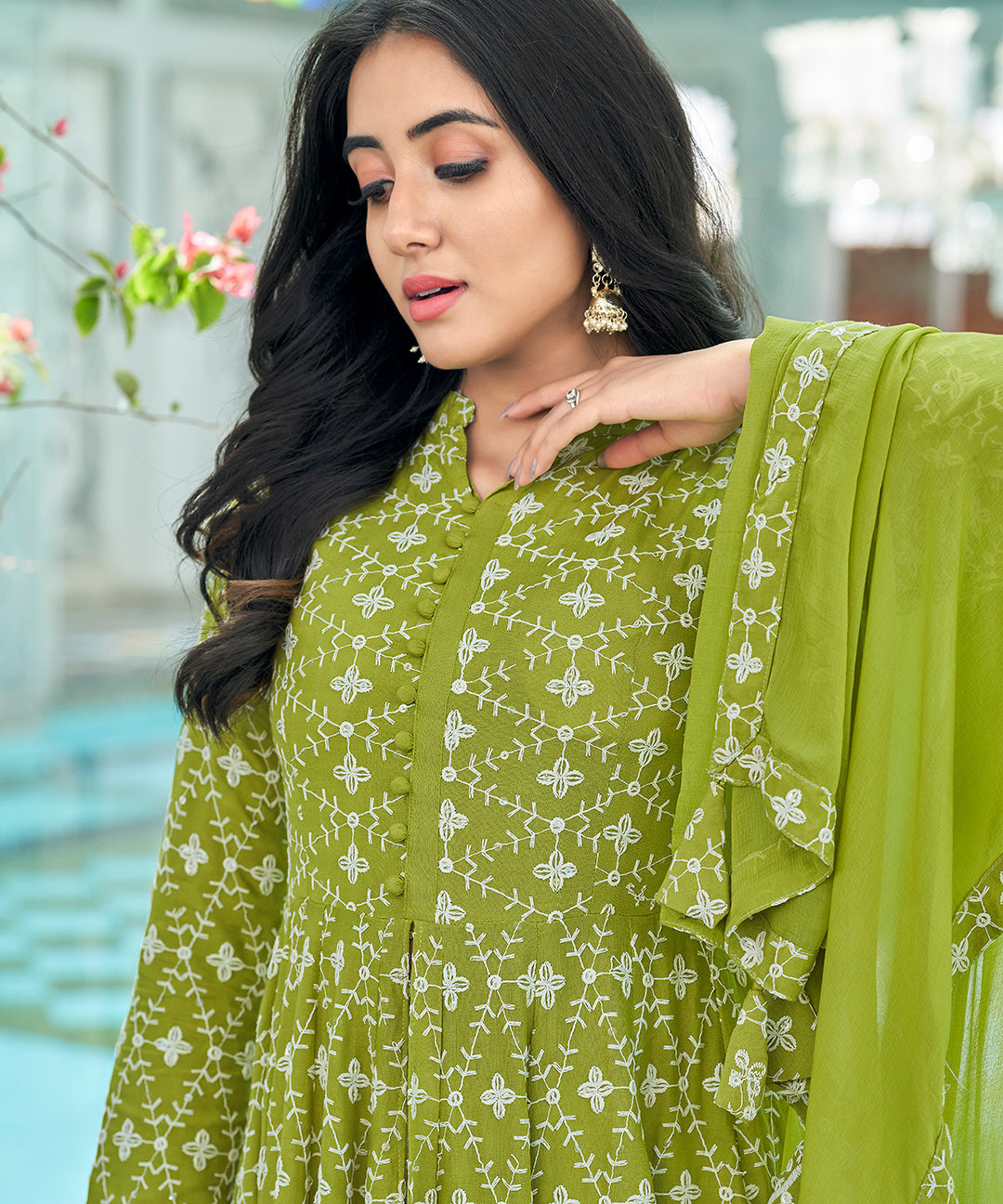 A graceful Tender Green Chikankari Suit Set, embellished with delicate chikankari embroidery for an elegant and refined appearance.