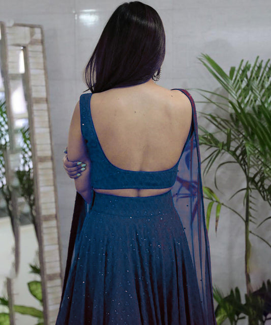 A turquoise blue Chikankari lehenga showcasing intricate embroidery.