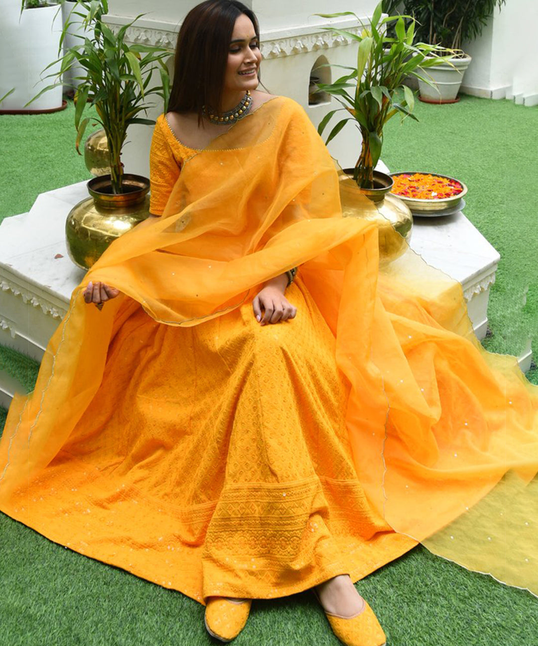 Yellow Designer Anarkali Gown in Cotton adorned with Lucknowi Chikankari Embroidery, showcasing intricate craftsmanship and elegance.