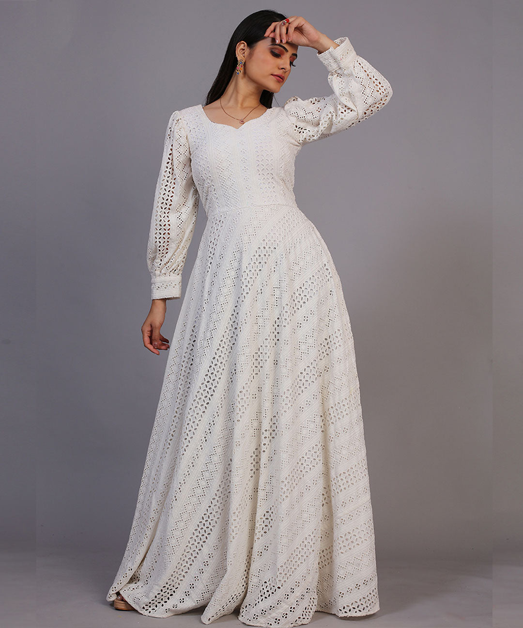 Classic off-white Lucknowi embroidered floor-length gown, showcasing timeless elegance and craftsmanship.