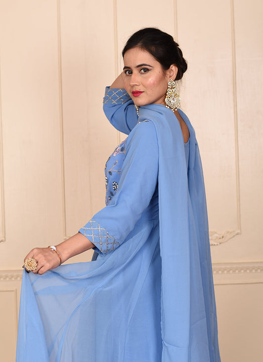 A stunning designer ensemble featuring intricate embroidery, shimmering motiwork embellishments, and a luxurious dupatta for a complete and glamorous look.