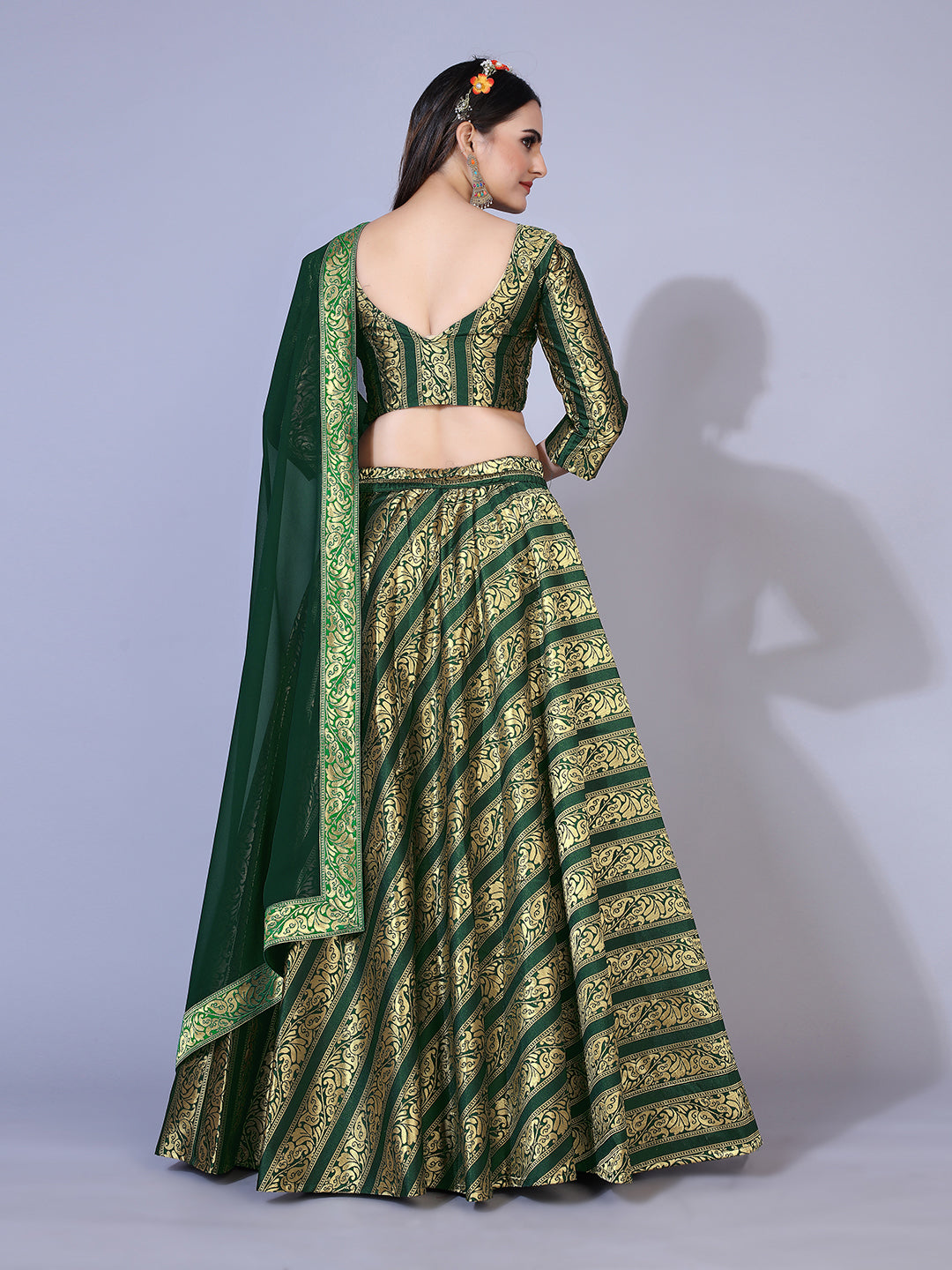 Eye-catching fluorescent green lehenga set with gold accents, ready to wear with blouse and dupatta.