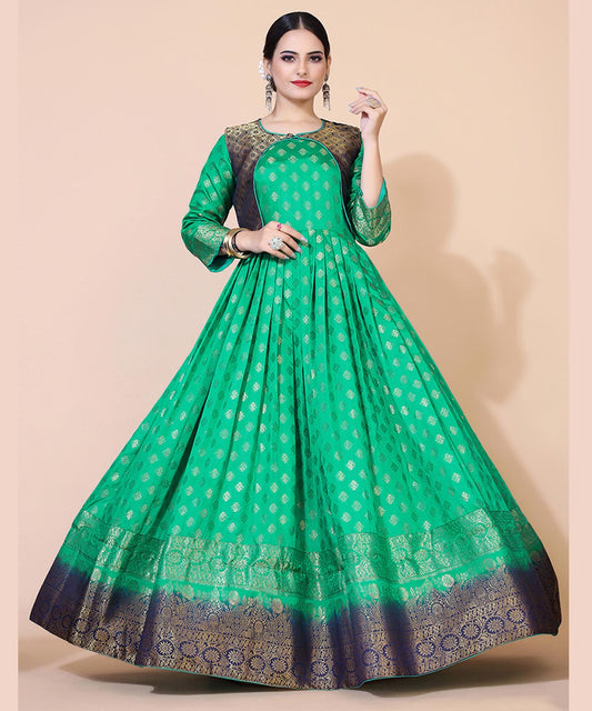 Green jacquard maxi dress adorned with ethnic motifs, ideal for cultural and festive occasions.