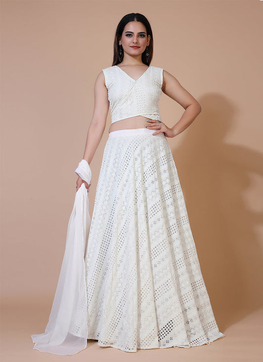 Milky white stylish lehenga with Angrakha style sleeveless crop top, ideal for modern and elegant occasions.