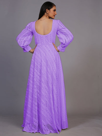 A stunning floor-length gown in rich purple, adorned with intricate Lucknowi embroidery.