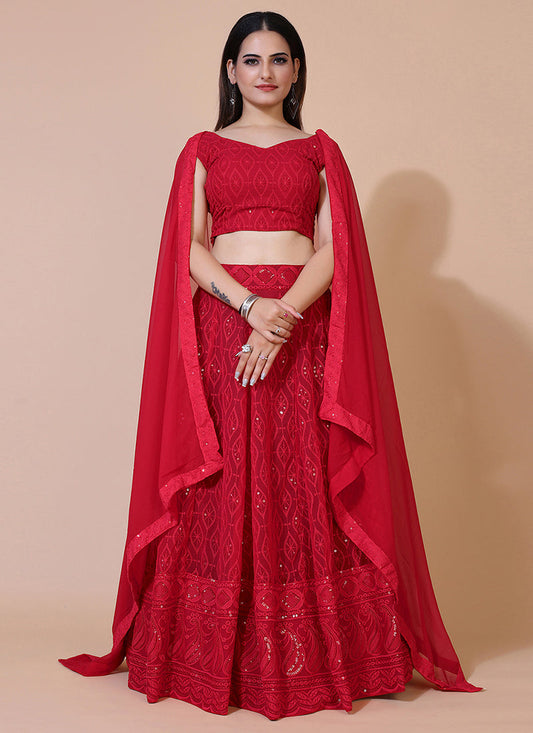 Red A-line Lucknowi Chikankari work stitched lehenga choli, ideal for traditional and festive celebrations with intricate embroidery.