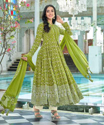 A graceful Tender Green Chikankari Suit Set, embellished with delicate chikankari embroidery for an elegant and refined appearance.