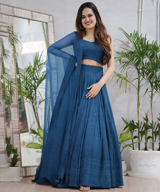 A turquoise blue Chikankari lehenga showcasing intricate embroidery.