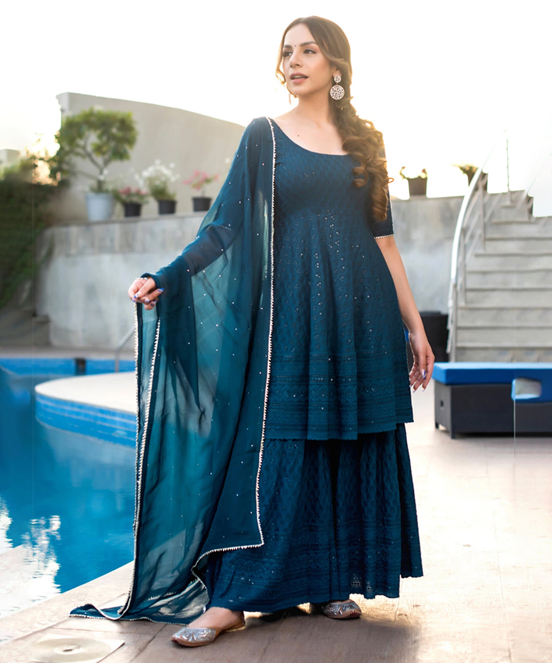 Turquoise blue Chikankari sharara set featuring intricate embroidery and a graceful design
