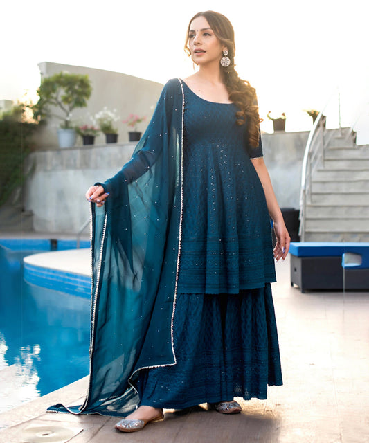 Turquoise blue Chikankari sharara set featuring intricate embroidery and a graceful design