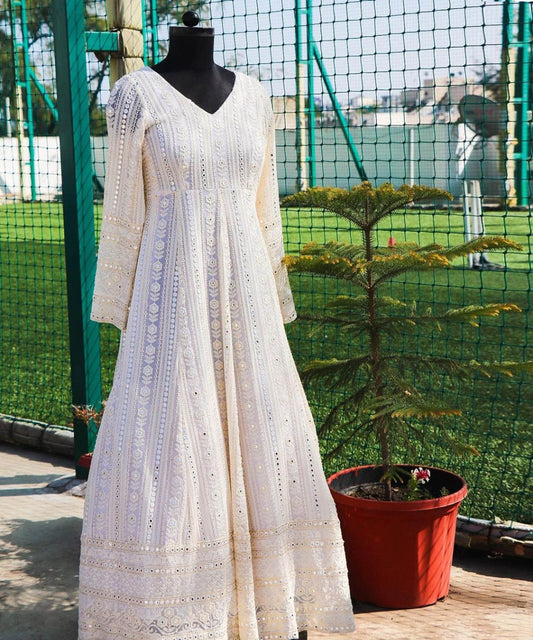 White Chikankari gown with intricate embroidery work, ideal for elegant and traditional occasions.