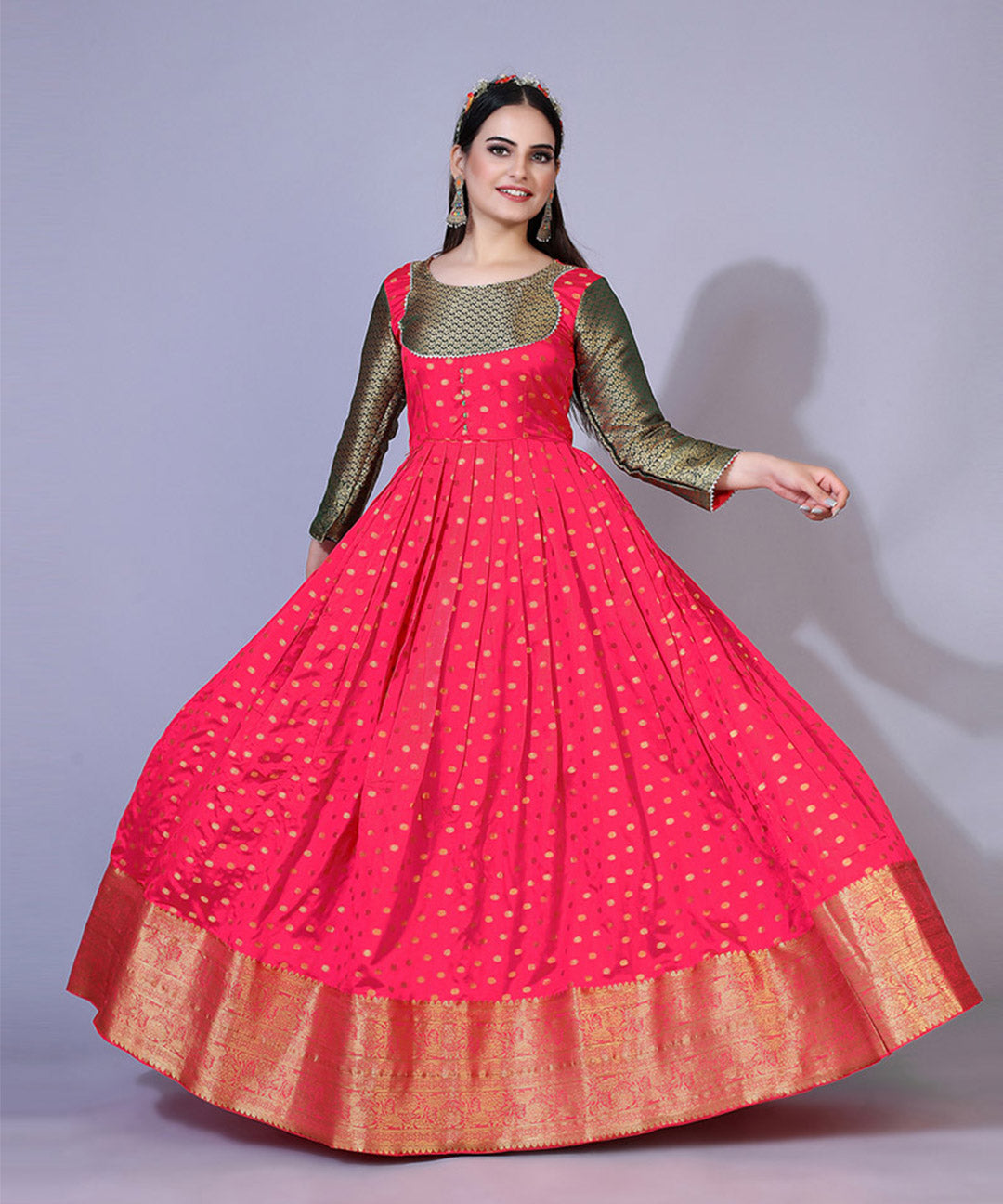 Women's pink jacquard maxi dress adorned with ethnic motifs, ideal for cultural and festive occasions.